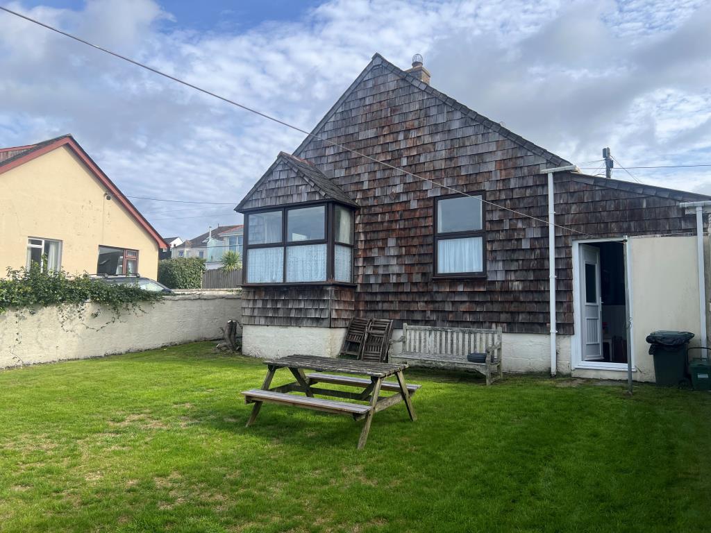 Lot: 114 - DETACHED CHALET STYLE BUNGALOW ON GOOD SIZE PLOT - Rear elevation and garden
